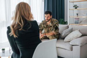 Military Divorce Counseling in Southern California: A service member in uniform discusses divorce-related matters with a professional, highlighting key benefits and timelines for military families in California.