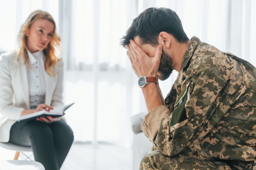 Military Man Sitting near the Lawyer to discuss the Legal Matters regarding Divorce