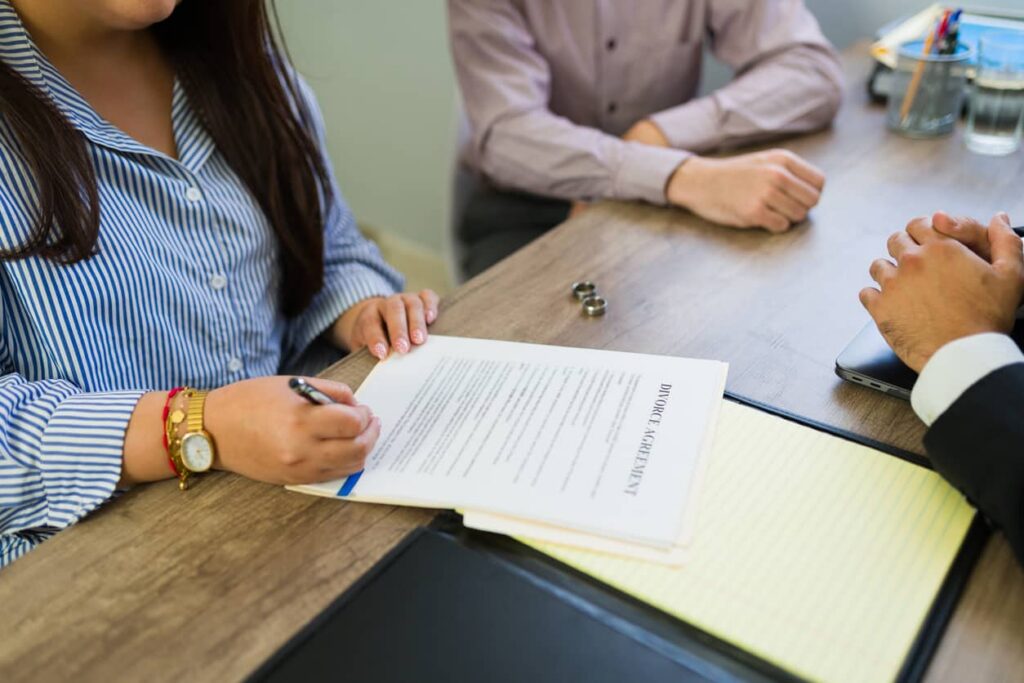 Couple discussing divorce case with lawyer in California